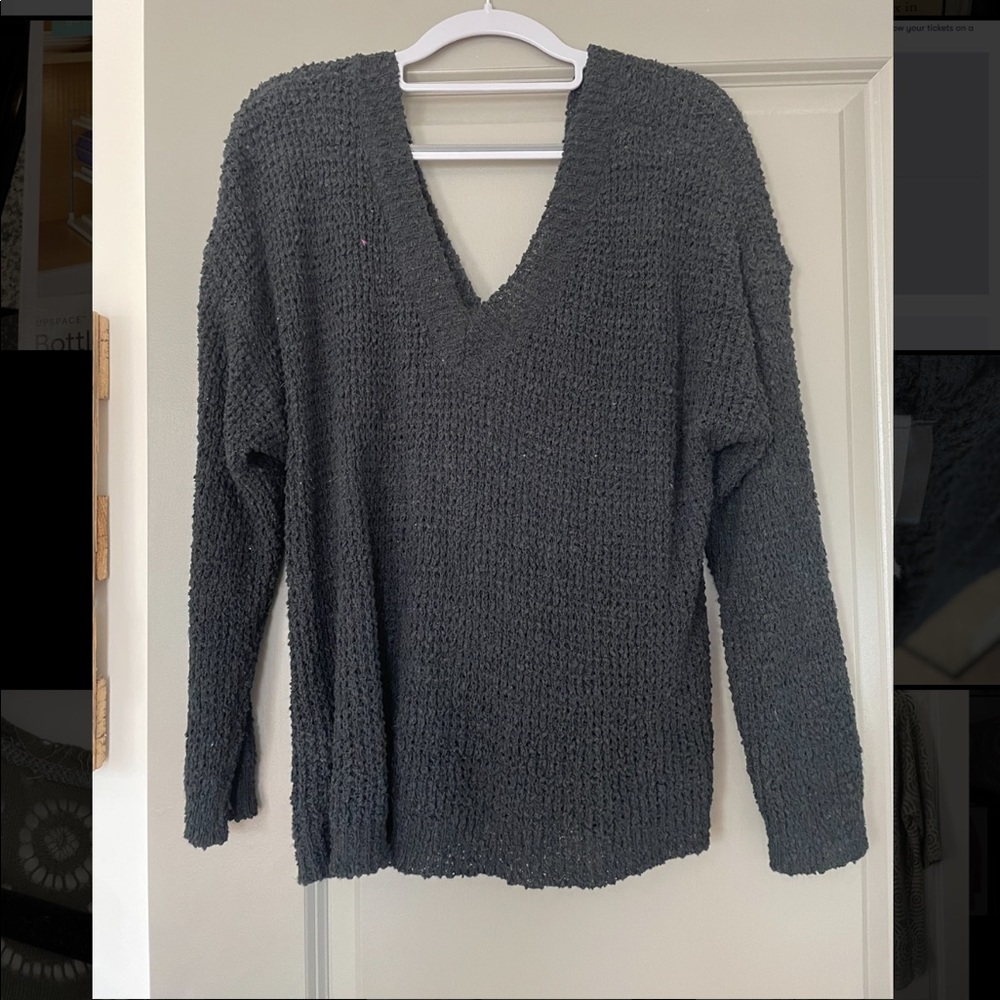 Black crochet sweater with open twisted back